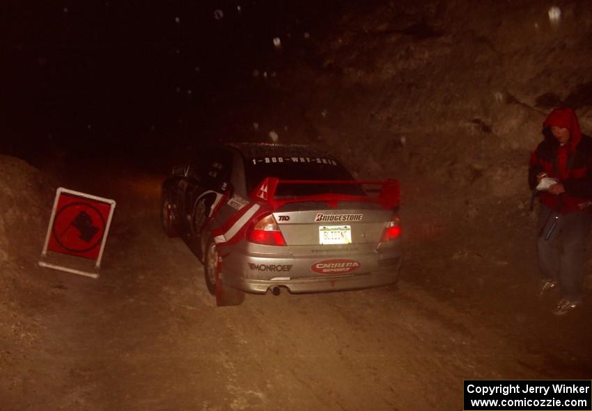 The Mark Cox / Jim Gill Mitsubishi Lancer Evo VI leaves the start of SS6.