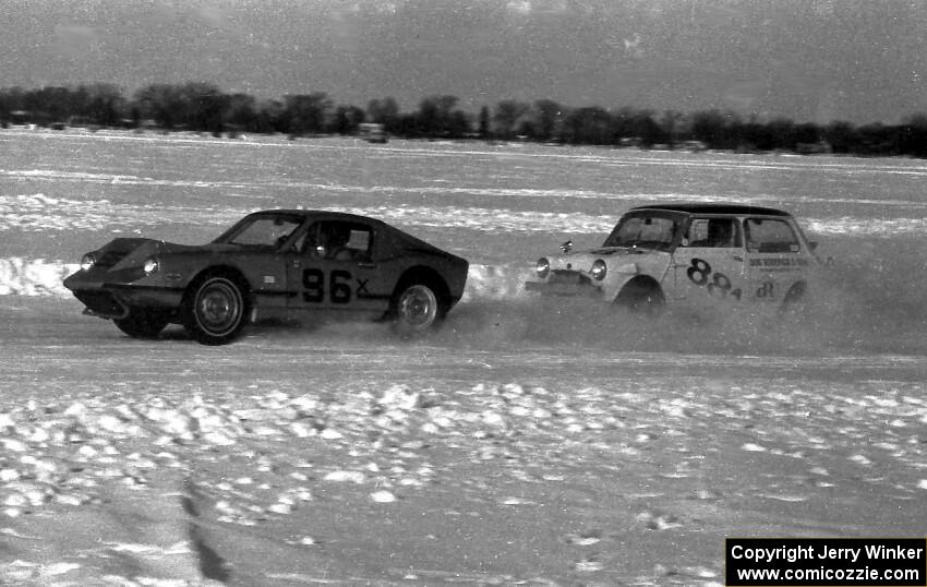 Scotty Bell's SAAB Sonnet II is chased by Don Roderick's Austin Mini Cooper S