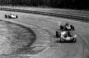 Cars stream through turn 9 during the race.