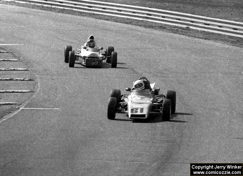 Phil Schrampfer's Merlyn Mk. 25 Formula Ford leads Rick Larsen's Lola T-440 Formula Ford through turn 9.