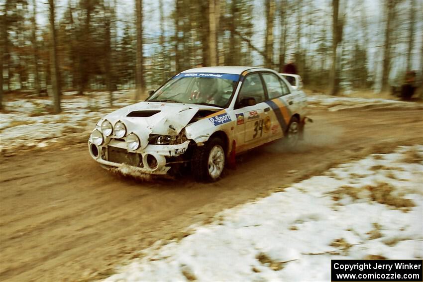 Pete Lahm / Frank Cunningham Mitsubishi Lancer Evo IV on SS2, Ranch I, shortly after hitting a tree.