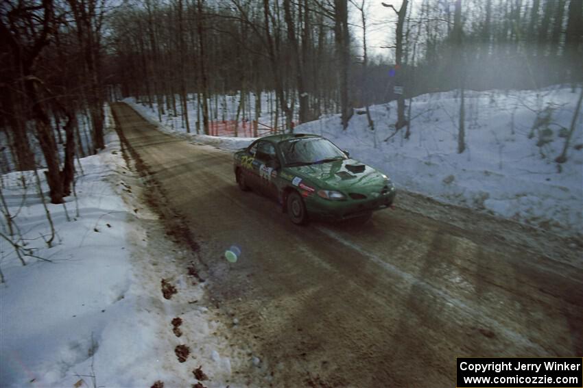 Tad Ohtake / Bob Martin Ford Escort ZX2 on SS9, Camp 8.