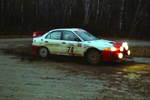 Paul Dunn / Pete Gossett Mitsubishi Lancer Evo IV at the spectator corner on SS4, Blue Trail.