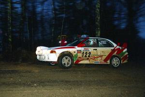 Dennis Martin / John Dillon Mitsubishi Lancer Evo IV at the spectator corner on SS4, Blue Trail.