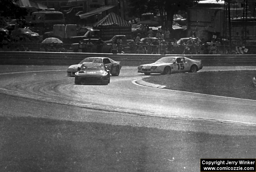 Paul Miller's Porsche 924 Carrera Turbo leads David Hobbs's Chevy Camaro and Joe Gonzalez's Chevy Camaro through turn 4