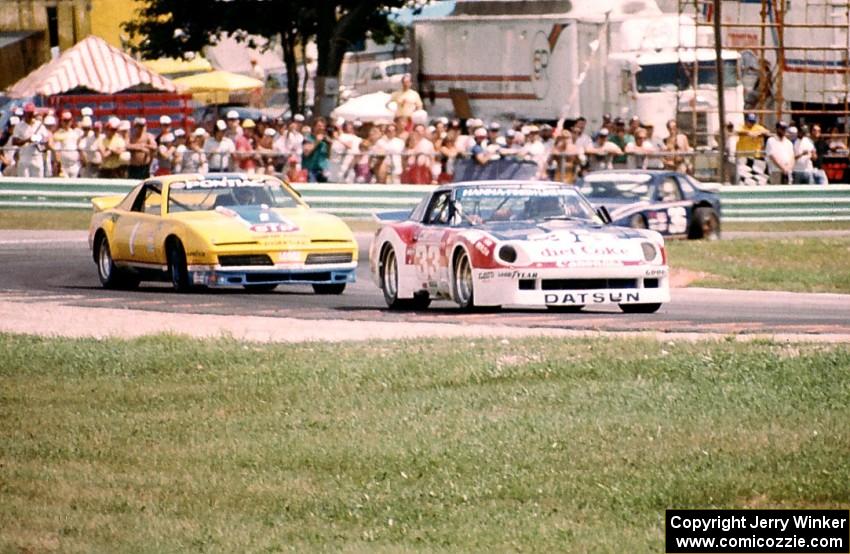 Paul Newman's Datsun 280ZX Turbo, Elliott Forbes-Robinson's Pontiac Trans-Am and Paul Miller's Porsche 924 Carrera Turbo