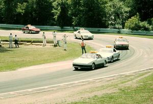 The PPG pace cars come through turn 12.