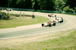 The field comes through Canada Corner (turn 12) on lap one.