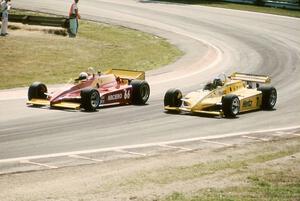 Pete Halsmer's Penske PC10/Cosworth makes an inside pass on Al Unser, Sr.'s Penske PC11/Cosworth