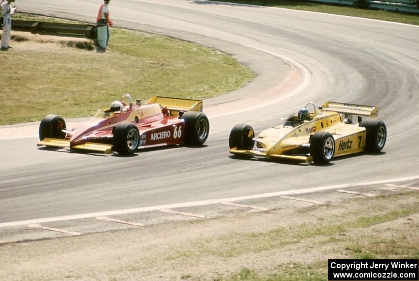 Pete Halsmer's Penske PC10/Cosworth makes an inside pass on Al Unser, Sr.'s Penske PC11/Cosworth