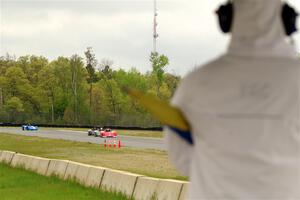 Ben Anderson's, Justin Elder's, Nolan Elder's and Lauren Dueck's Spec Racer Ford 3s come out of turn 3 on lap 1.