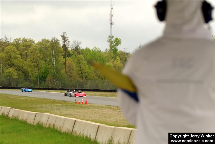 Ben Anderson's, Justin Elder's, Nolan Elder's and Lauren Dueck's Spec Racer Ford 3s come out of turn 3 on lap 1.