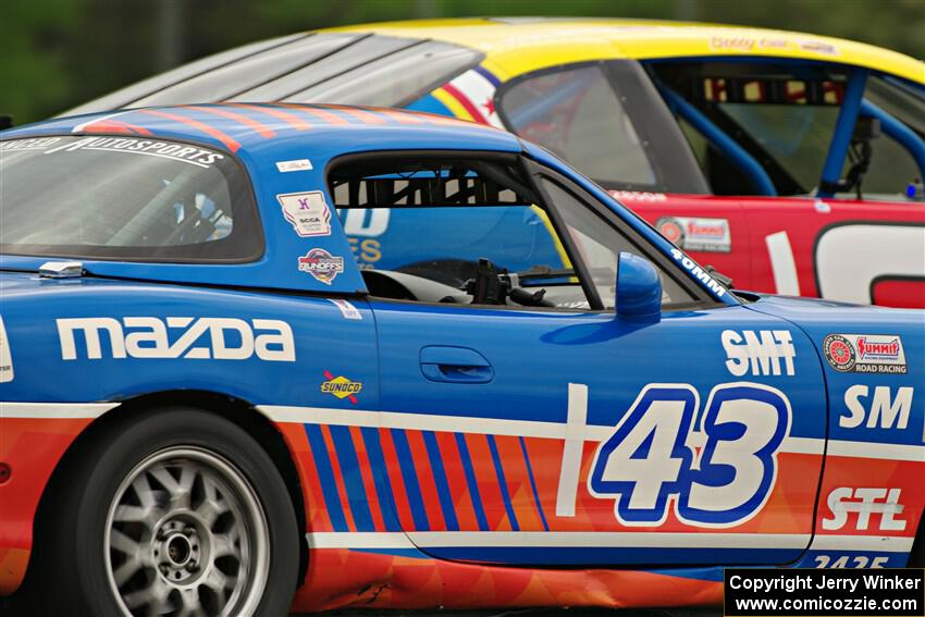Bruce Allen's Spec Miata Mazda Miata and Jim Kulseth's GTA Chevy Monte Carlo