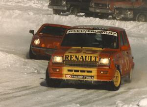 Jerry Orr's Renault LeCar leads Tom Schramm's Lotus Europa through the final corner