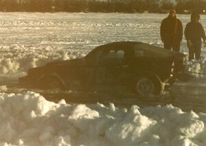 Pete Conners's SAAB Sonnet II two-stroke started to break through the ice in the pits. It was freed okay.