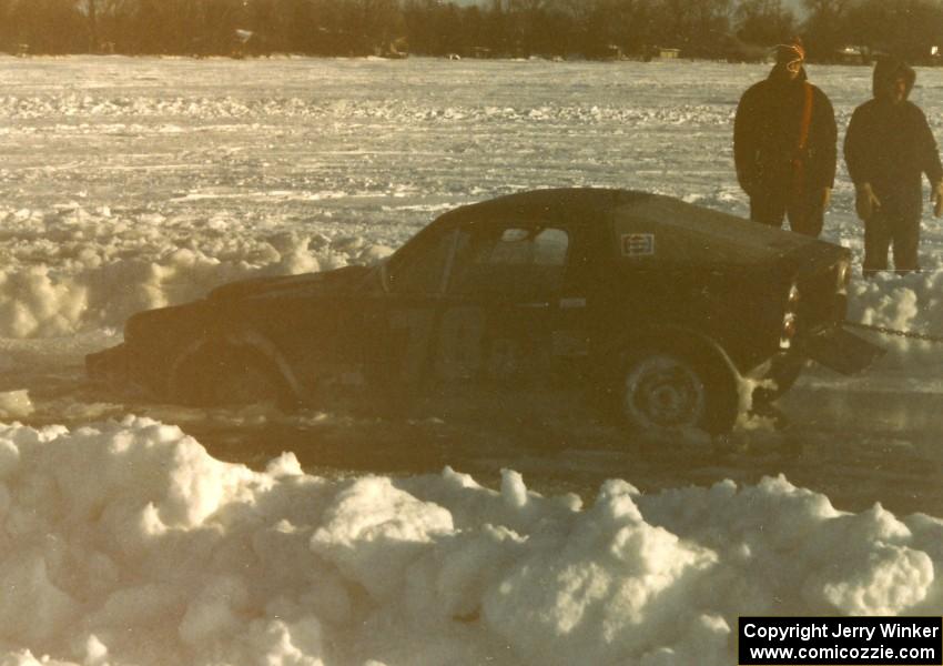 Pete Conners's SAAB Sonnet II two-stroke started to break through the ice in the pits. It was freed okay.