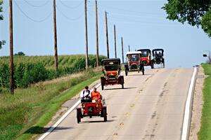 Five cars stream down a hill on the way into Buffalo.