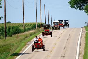 Five cars stream down a hill on the way into Buffalo.
