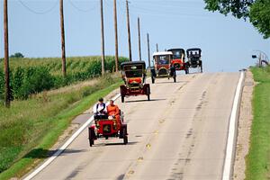 Five cars stream down a hill on the way into Buffalo.