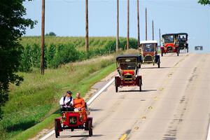 Five cars stream down a hill on the way into Buffalo.