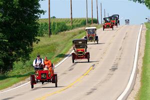 Five cars stream down a hill on the way into Buffalo.