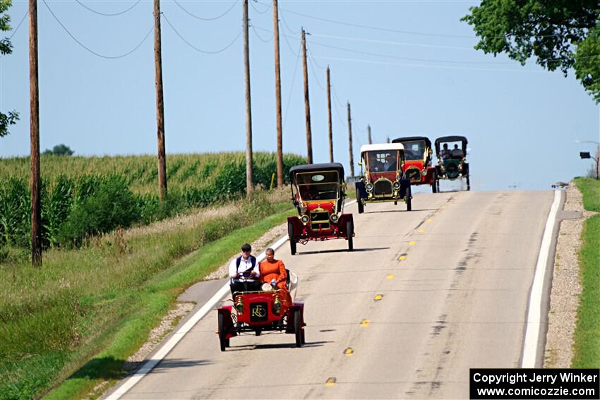 Five cars stream down a hill on the way into Buffalo.