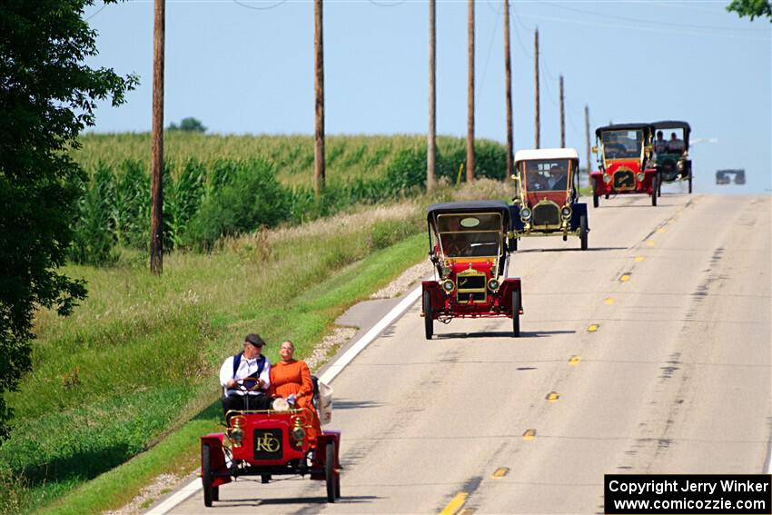 Five cars stream down a hill on the way into Buffalo.