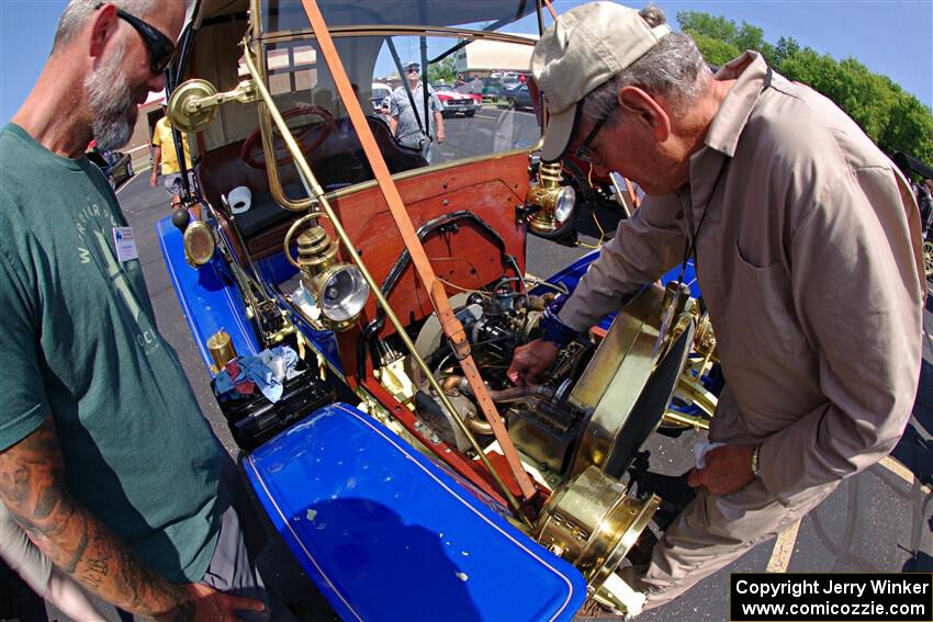 Dave Helgeson's 1908 Buick gets the oil topped off in Buffalo.