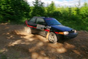 Joe Boburka / Elizabeth Unglenieks-Ploeg Ford Escort on SS5, Chainsaw Junksin.