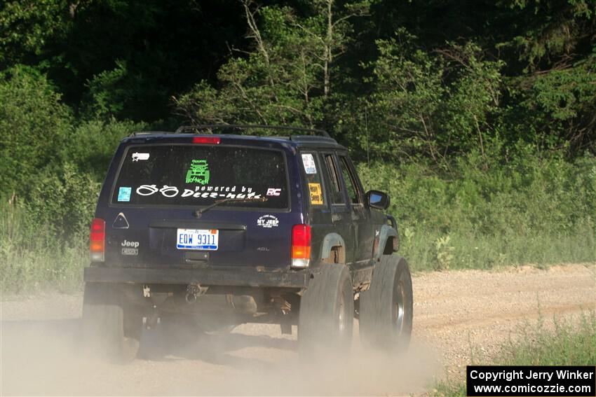 A Jeep Wrangler sweeps SS6, Camp 3 South.