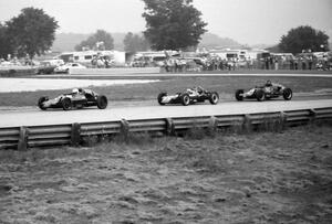 Chris Schultz's Zink Z-18 battles John Hogdal's Napmobile RJ-2 and Scott Rubenzer's Citation 84V during the Formula Vee race