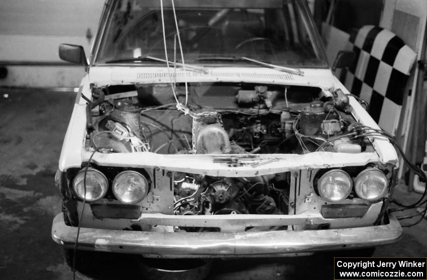 Engine work being done to the Dave Strot / Mike Winker Datsun 510 before the race.