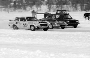 Ray Miller's Chevy Vega V-8, Tom Schramm's Lotus Europa and Jeff Burke's VW GTI go side-by-side into turn one.