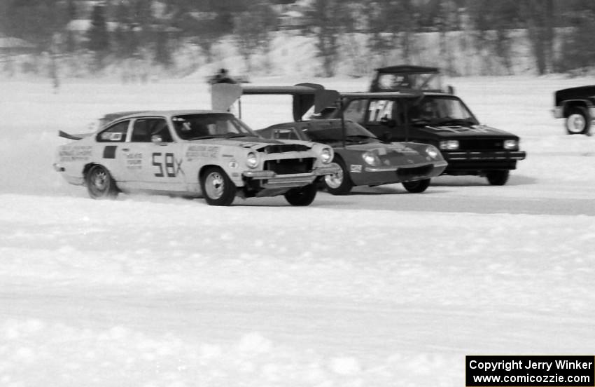 Ray Miller's Chevy Vega V-8, Tom Schramm's Lotus Europa and Jeff Burke's VW GTI go side-by-side into turn one.