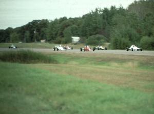 The field comes into turn one an lap one.