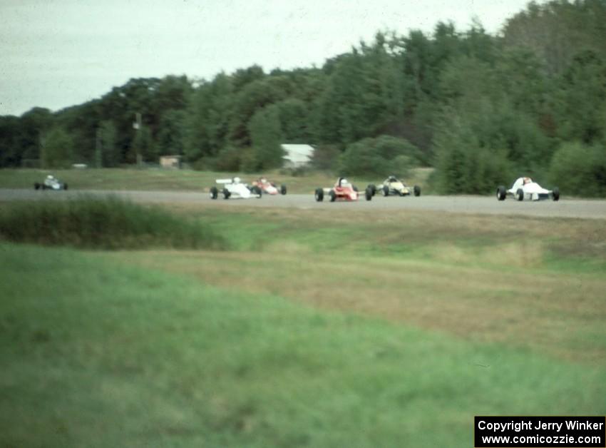 The field comes into turn one an lap one.