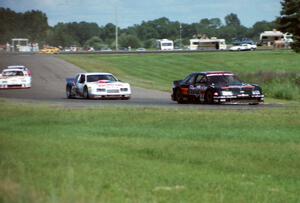 Four cars stream into turn seven.