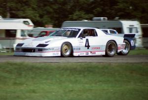 Wally Dallenbach, Jr.'s Chevy Camaro and Tommy Riggins's Buick Somerset Regal go side-by-side into turn ten.