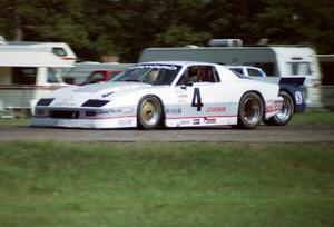 Wally Dallenbach, Jr.'s Chevy Camaro and Tommy Riggins's Buick Somerset Regal go side-by-side into turn ten.