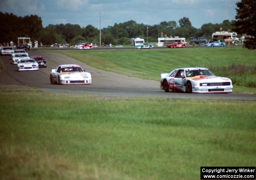 The field streams through turns 6 and 7 on lap one.