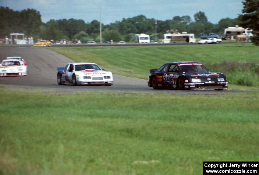 Four cars stream into turn seven.