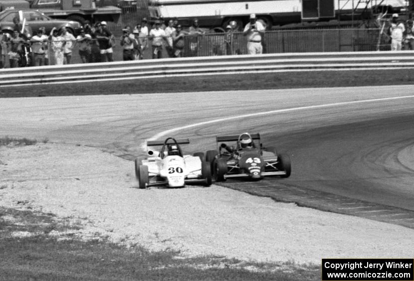 Steve Bren's Ralt RT-5/86 forces Didier Theys's Martini Mk.50 off turn five on the second to last lap.