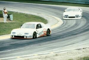 Pete Halsmer's Merkur XR4Ti and Wally Dallenbach's Chevy Camaro