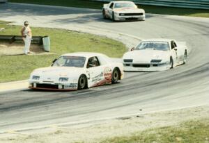 Pete Halsmer's Merkur XR4Ti, Wally Dallenbach, Jr.'s Chevy Camaro and Chris Kneifel's Mercury Capri