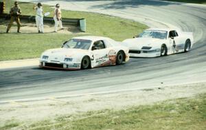 Pete Halsmer's Merkur XR4Ti and Wally Dallenbach, Jr.'s Chevy Camaro two turns from the finish