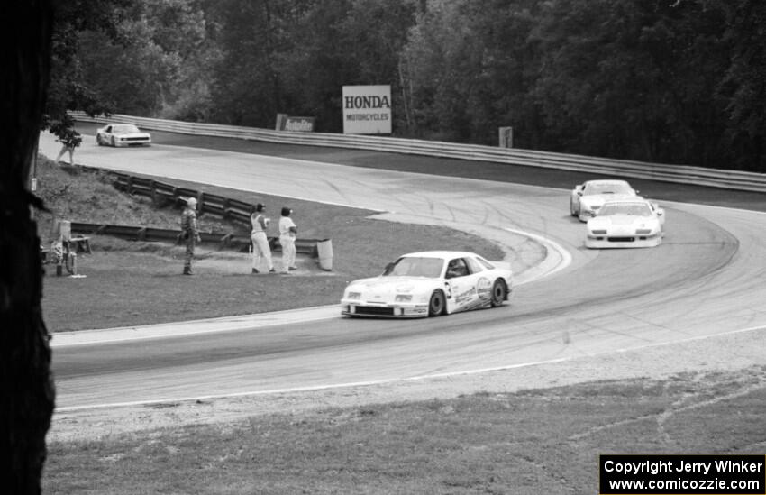 Pete Halsmer's Merkur XR4Ti, the Chevy Camaros of Wally Dallenbach, Jr. and Greg Pickett and Chris Kneifel's Mercury Capri