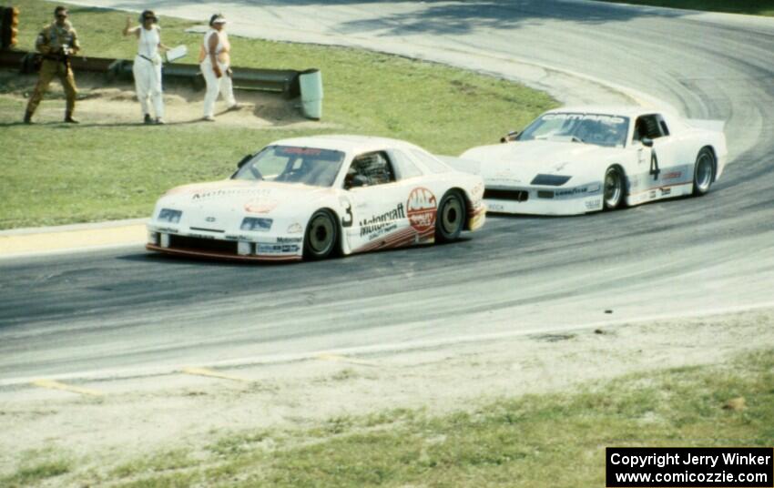 Pete Halsmer's Merkur XR4Ti and Wally Dallenbach, Jr.'s Chevy Camaro two turns from the finish