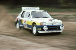 The Jon Woodner / Tony Sircombe Peugeot 205 T16 at speed on SS1 at the speedway.