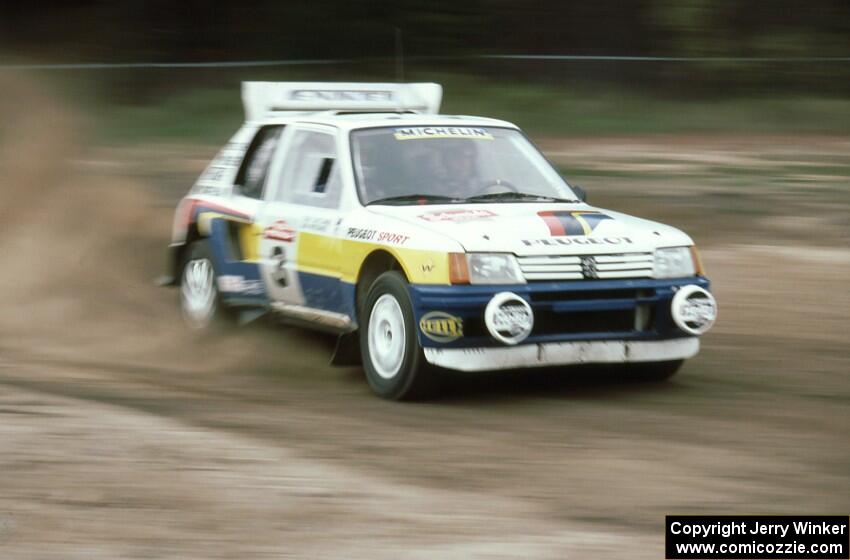 The Jon Woodner / Tony Sircombe Peugeot 205 T16 at speed on SS1 at the speedway.