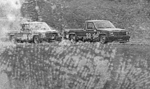 Bobby Archer leads brother Tommy out of turn six in their Jeep Comanches during qualifying.